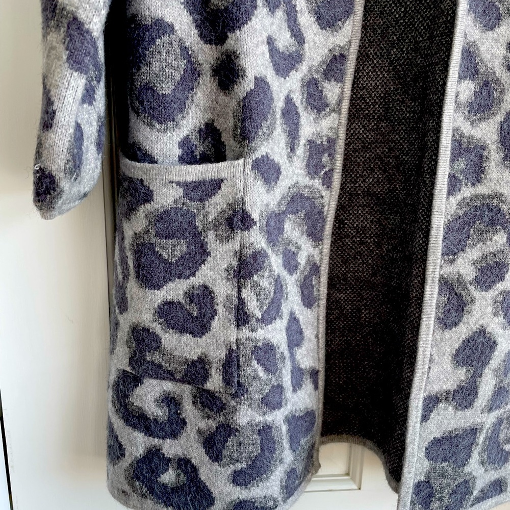 3/4 length camo sweater coat. 2 pockets. Barely worn